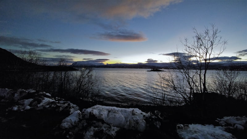 Playful light of the Polar Night along the fjords while road-tripping the islands of Arctic Norway.