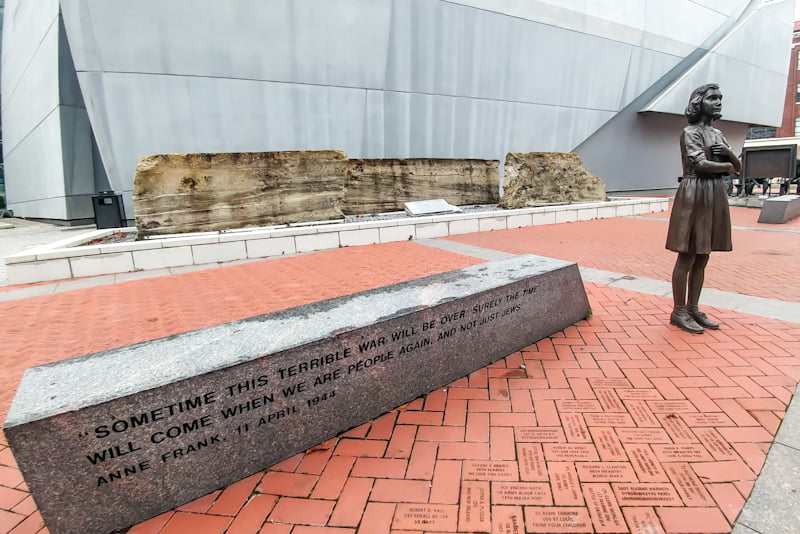 Outside, on the National Museum’s grounds, dedicated bricks pepper the ground among bronze statues of notable wartime figures, like Anne Frank.