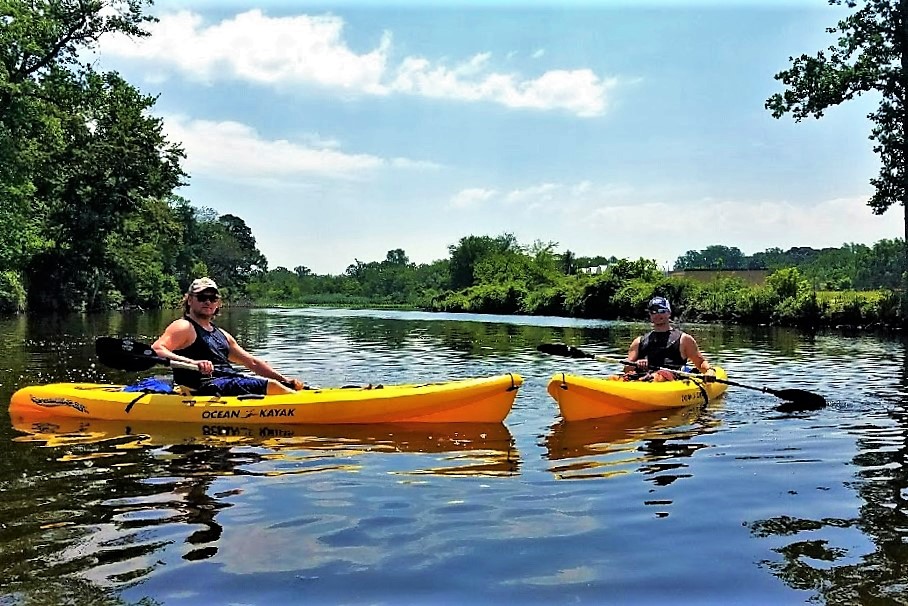 Author and friend on a peaceful eco-tour on the Broadkill River with Quest Fitness Kayak on Delaware coast. 