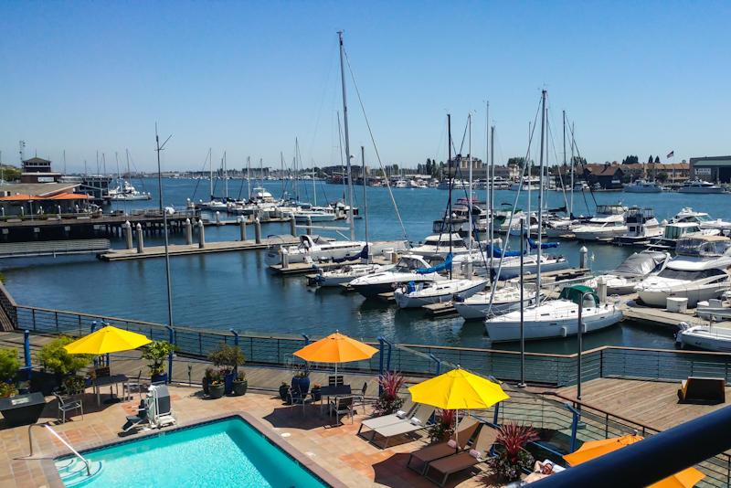 Sweeping views including the famed marina Waterfront Hotel, which features the ferry across the Bay just steps away.