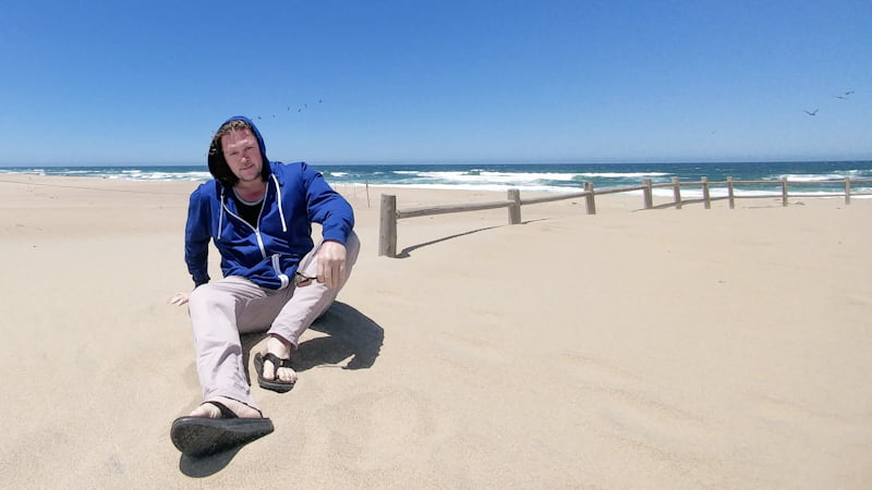 The author at the coastal dunes on a remote escape into an otherworldly environment.