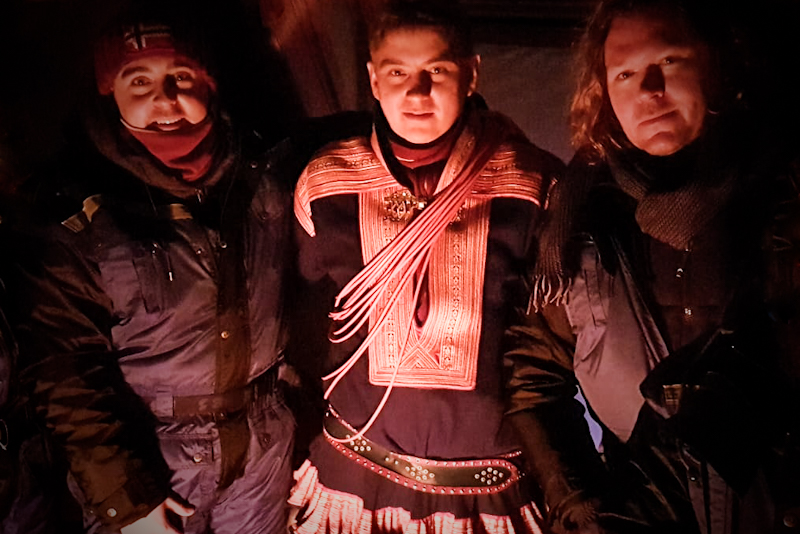 Warming up with Sámi, Dimitri, in a lavvu while experiencing the native culture.