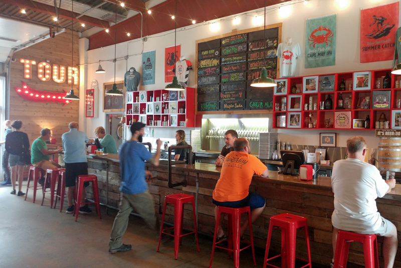 The colorful tasting room of Cape May Brewing Co. on a hot summer day.